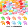 A collection of 100 colorful resin turtle ornaments in various shades and translucent colors for home decor