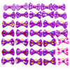 A collection of adorable pet hair bows in various colors and patterns with gentle rubber bands.