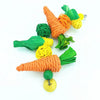 Handwoven natural vine bird and pet swing toy featuring orange and green yarn components.