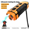 An orange ultrasonic training device is shown emitting sound towards a dog.
