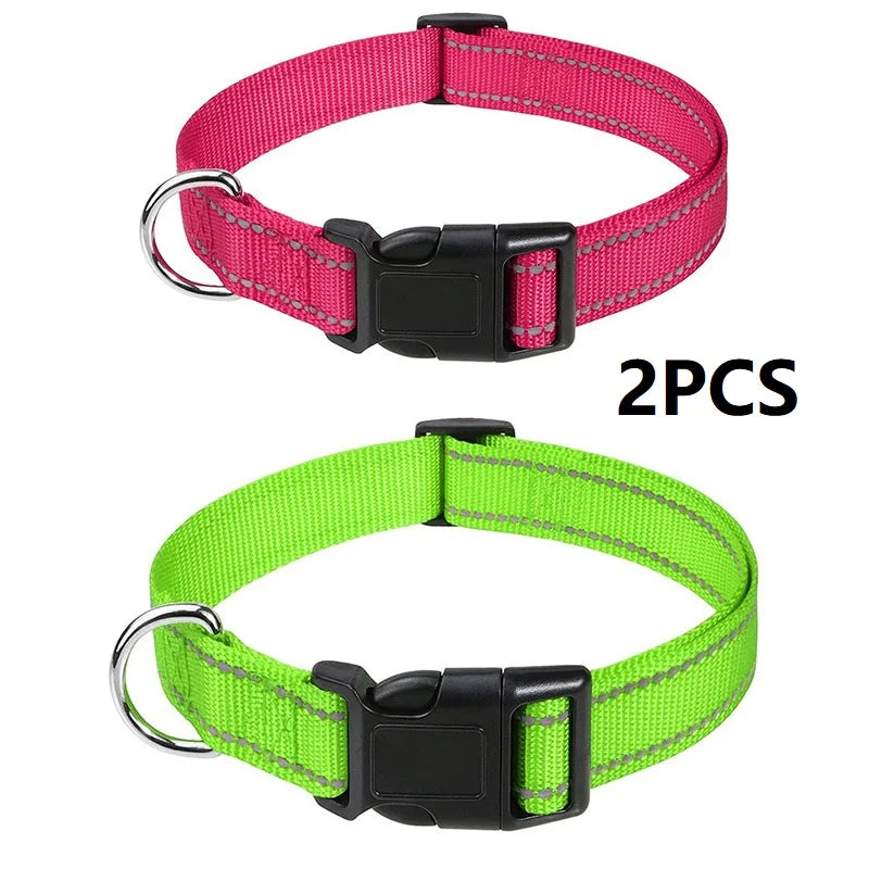 Two nylon dog collars, one pink and one lime green, with buckles.