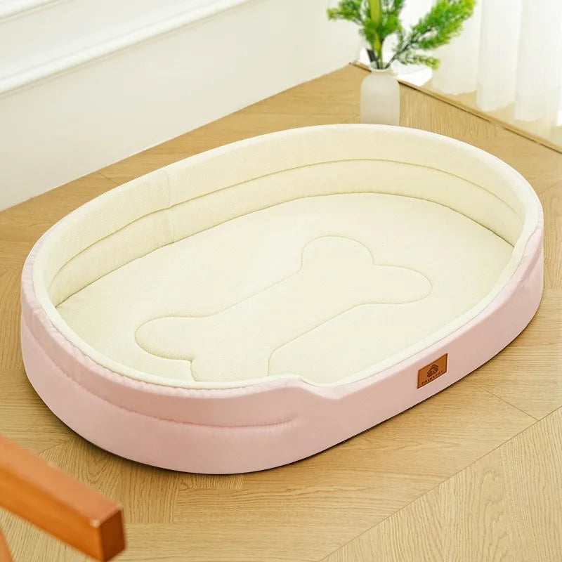 A pink washable waterproof dog bed mat with a light beige interior is shown on a wooden surface.