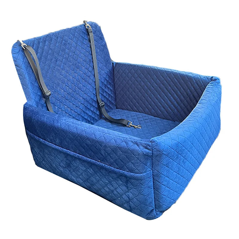 A blue quilted dog car seat with a removable orthopedic cushion and straps.