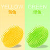 A set of silicone hair and scalp massage brushes in pink, yellow, green, and blue.