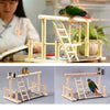 A wooden multi-level bird activity center featuring a perch and a hammock for birds.