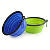 A blue silicone dog travel bowl is shown next to a lime green silicone bowl.
