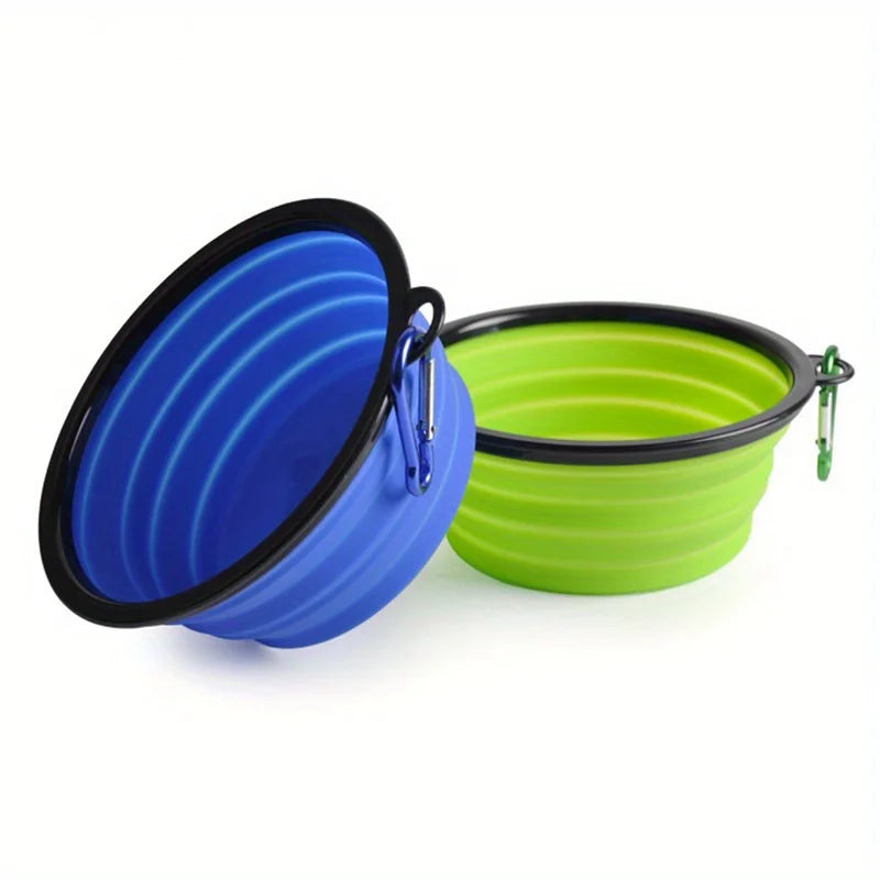 A blue silicone dog travel bowl is shown next to a lime green silicone bowl.