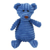 Un juguete de peluche azul que parece un oso con una nariz marrón y pelaje texturizado.