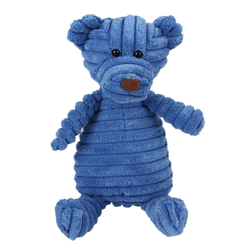 Un juguete de peluche azul que parece un oso con una nariz marrón y pelaje texturizado.