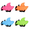 Three brightly colored water resistant life vests for dogs in pink, orange, and light blue.