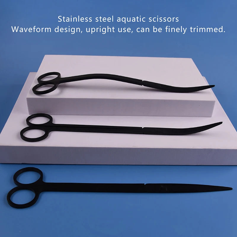 A set of black stainless steel aquatic scissors displayed on a white platform.