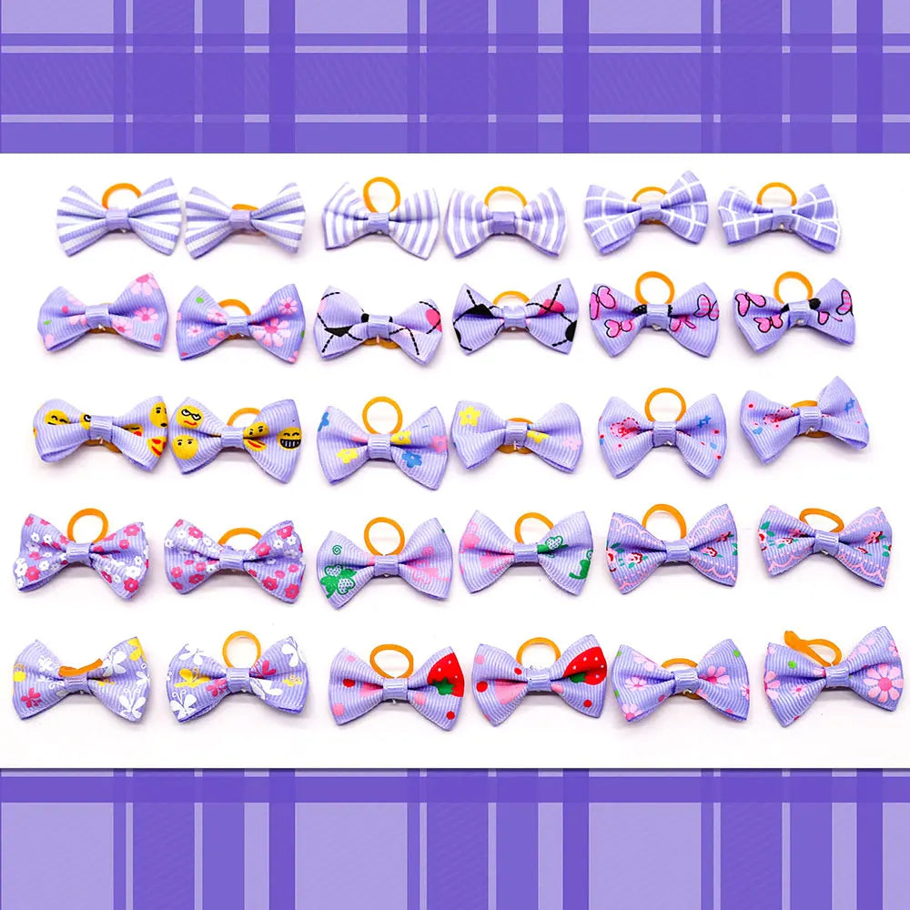 A collection of colorful pet hair bows in various patterns and colors attached with gentle rubber bands.