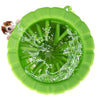 A bright green silicone pet paw cleaner with a textured surface and a small dog paw visible inside.