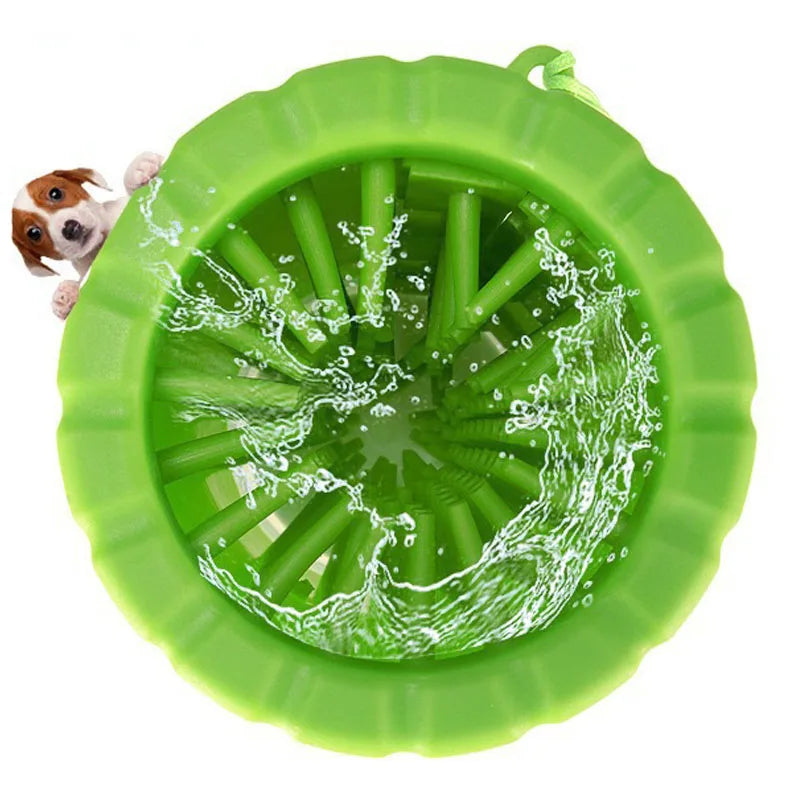 A bright green silicone pet paw cleaner with a textured surface and a small dog paw visible inside.