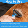 A hand is using a black pet deshedding brush on an orange-colored dog's fur.