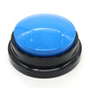 A round blue pet communication button with a black base for dog training.