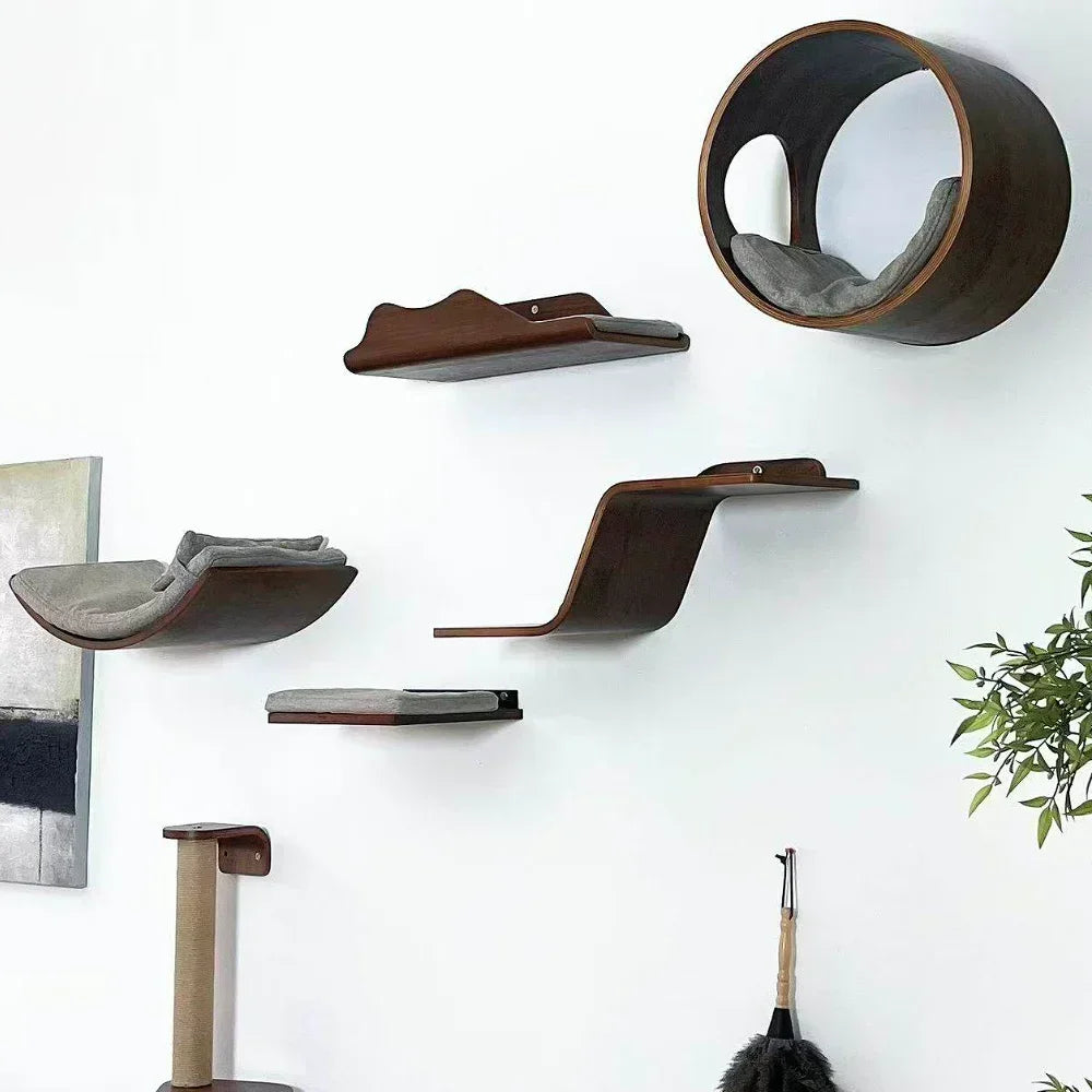Wall-mounted cat tree featuring a wooden scratching post, stairs, and hammock mounted on a white wall.