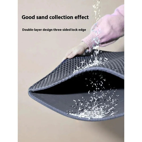 A hand is pouring sand into a dark gray double-layer cat litter mat, demonstrating its good sand collection effect.