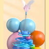 A colorful interactive cat turntable toy featuring rolling balls and a feather wand.