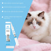 A white cat is resting on pink fabric next to a bottle of Pet Tear Stain Remover Pen for dogs and cats.