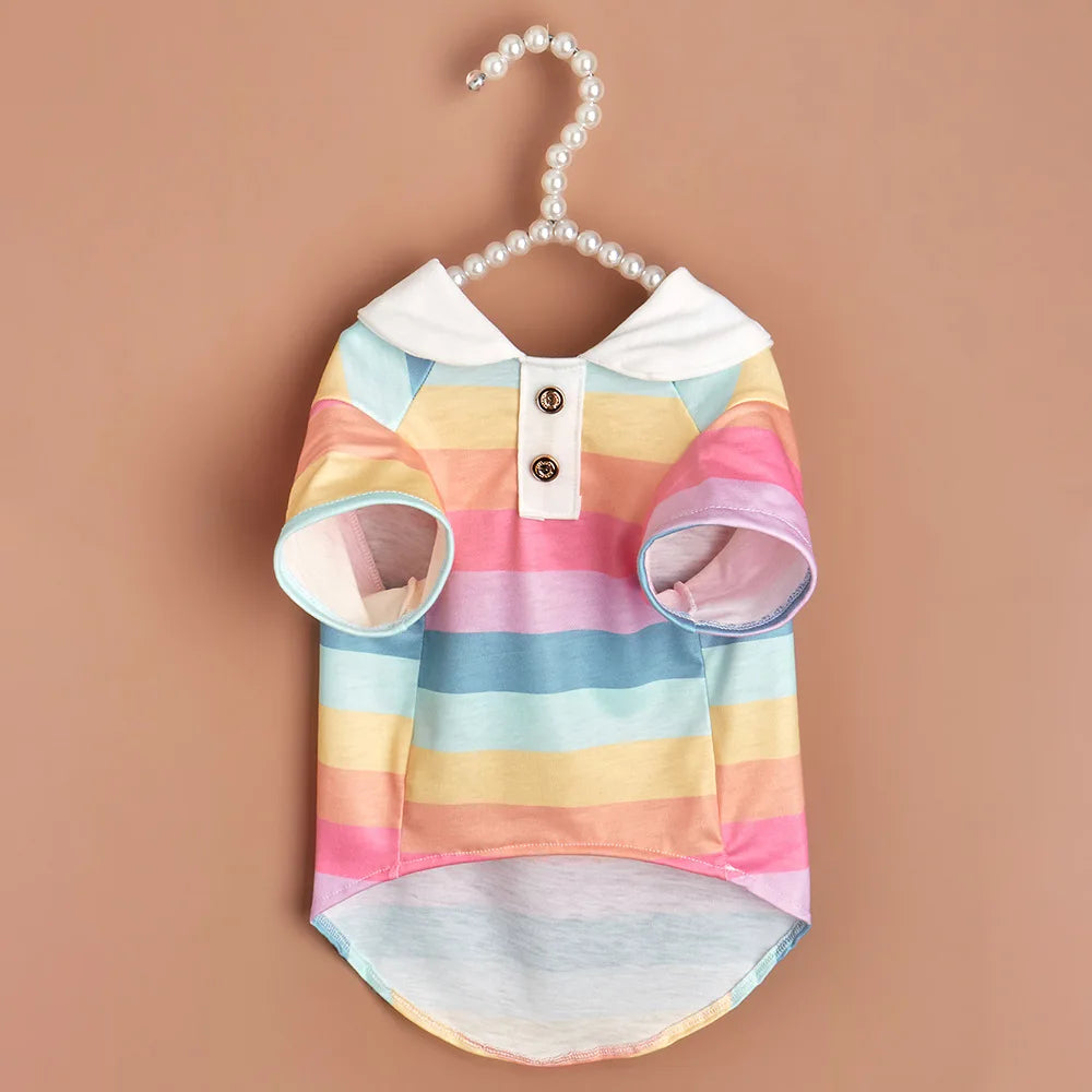 A striped polo shirt for a small dog featuring pastel horizontal stripes and white trim.