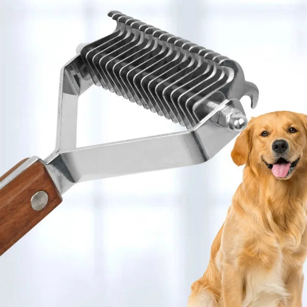 A dog is looking at a silver double-sided grooming comb and brush set with a wooden handle.