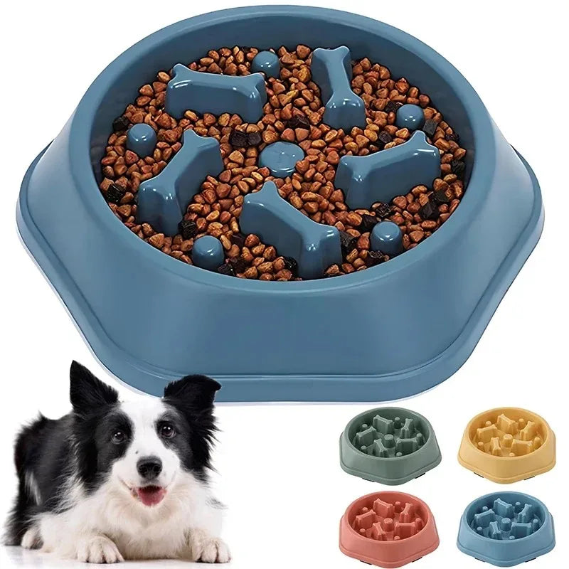 A blue anti-choking slow feeder dog bowl filled with kibble and various puzzle designs.