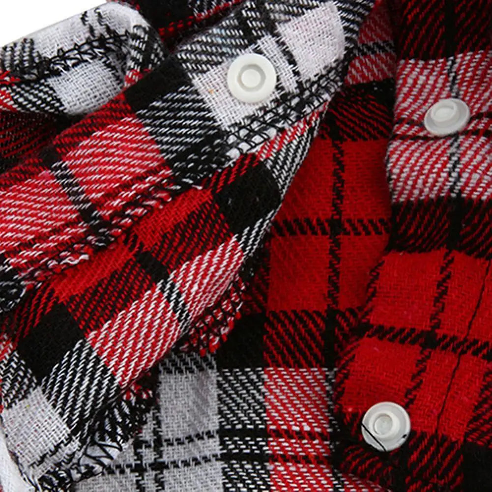 Close-up of a plaid button-up shirt featuring red, black, and white checkered patterns.