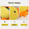 Detail display of a yellow embroidered duck plush toy with orange accents showing its texture and stitching.