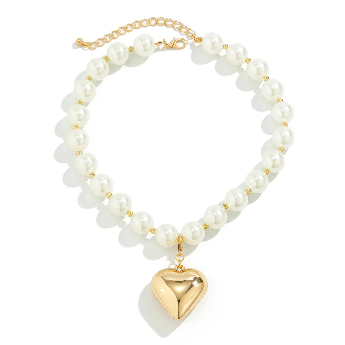 A delicate gold chain choker necklace featuring multiple strands of white pearls and a heart-shaped pearl pendant.