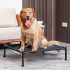 A golden retriever sits on a black portable folding pet bed with a removable cover.