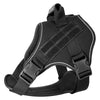 Black tactical dog harness with a reflective vest for training and outdoor adventures