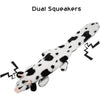 A white and black cow-patterned squeaky dog toy is shown, designed for stimulation.