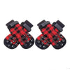 Pair of black and red plaid dog socks with paw protection and warmth features
