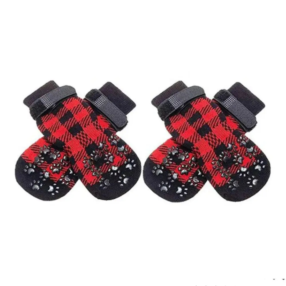 Pair of black and red plaid dog socks with paw protection and warmth features