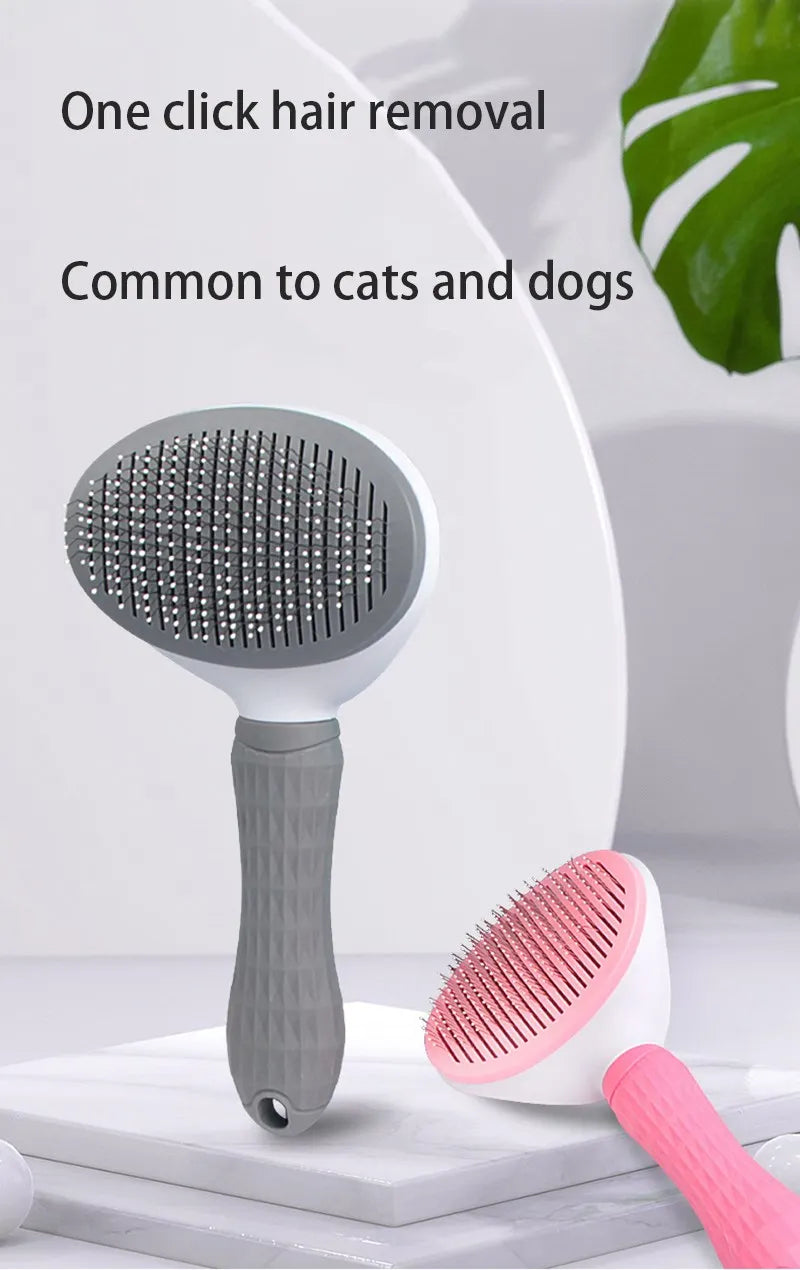 A gray pet hair removal brush with massage pins is shown next to a pink version on a white surface.
