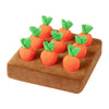 An interactive snuffle mat for pets featuring orange carrot-shaped toys.