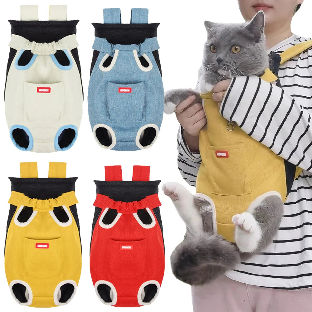 A gray cat is being held by a person wearing a yellow cycling walking pet carrier for cats.