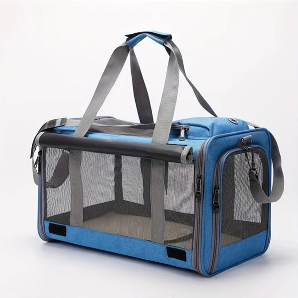 A blue soft-sided pet carrier for cats and puppies with gray fabric handles and mesh sides.