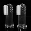 A clear silicone finger toothbrush for pets, showing the brush and holder.