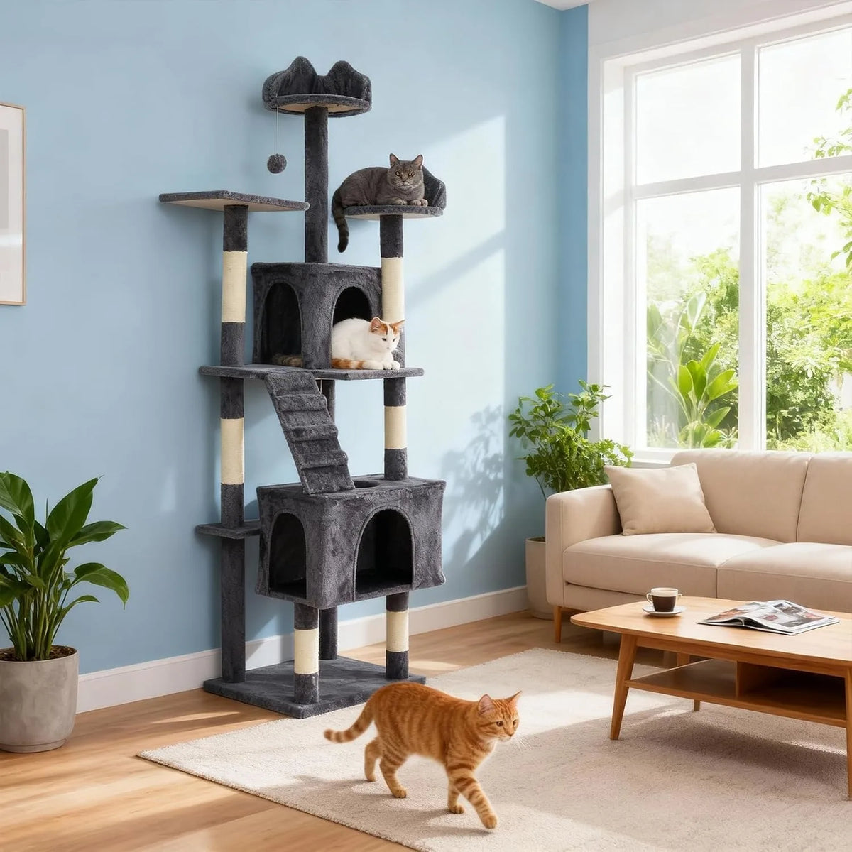 A multi-level gray cat tree with scratching posts and anti-tip kit stands in a bright living room next to a window.