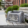 A gray breathable pet carrier backpack with a mesh window is resting on a wooden bench outdoors.