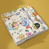 A stack of self-adhesive pet swaddles featuring colorful, cartoon-style designs for nail clipping and restraint.
