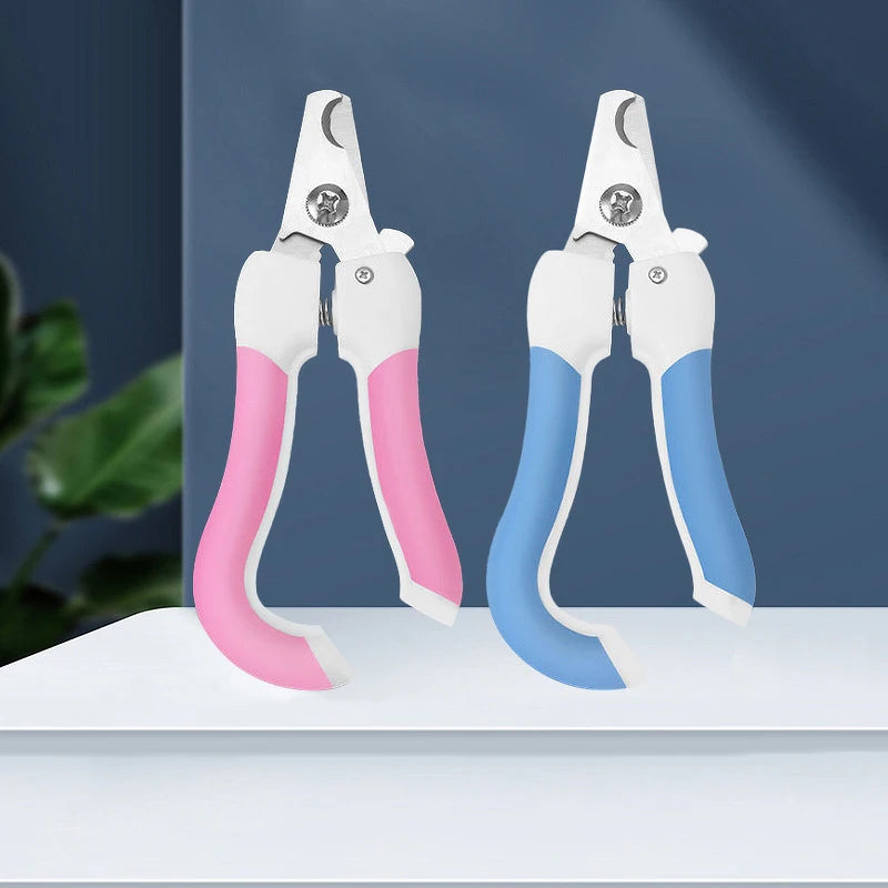 A pair of white and blue stainless steel pet nail clippers for dog and cat grooming displayed on a white surface.