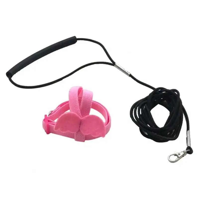 Pink parrot bird harness and leash set with a black strap and clip.