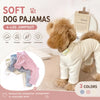 A fluffy dog is wearing a light beige soft stretch four-leg jumpsuit pajama set.