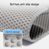 Close-up view of a gray honeycomb cat litter mat showing the bottom anti slip design and notch pattern.
