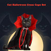 A black cat wearing a red cape and collar costume set for Halloween.