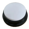 A round, black and white button used for dog training.