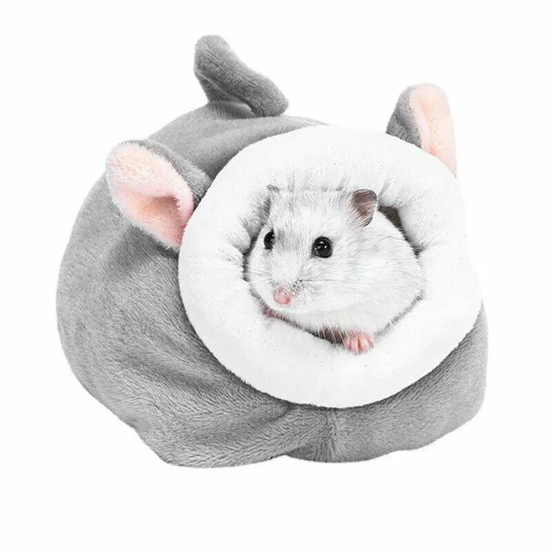 A gray plush hamster sleeping nest with pink ears and a white cotton house for small pets.